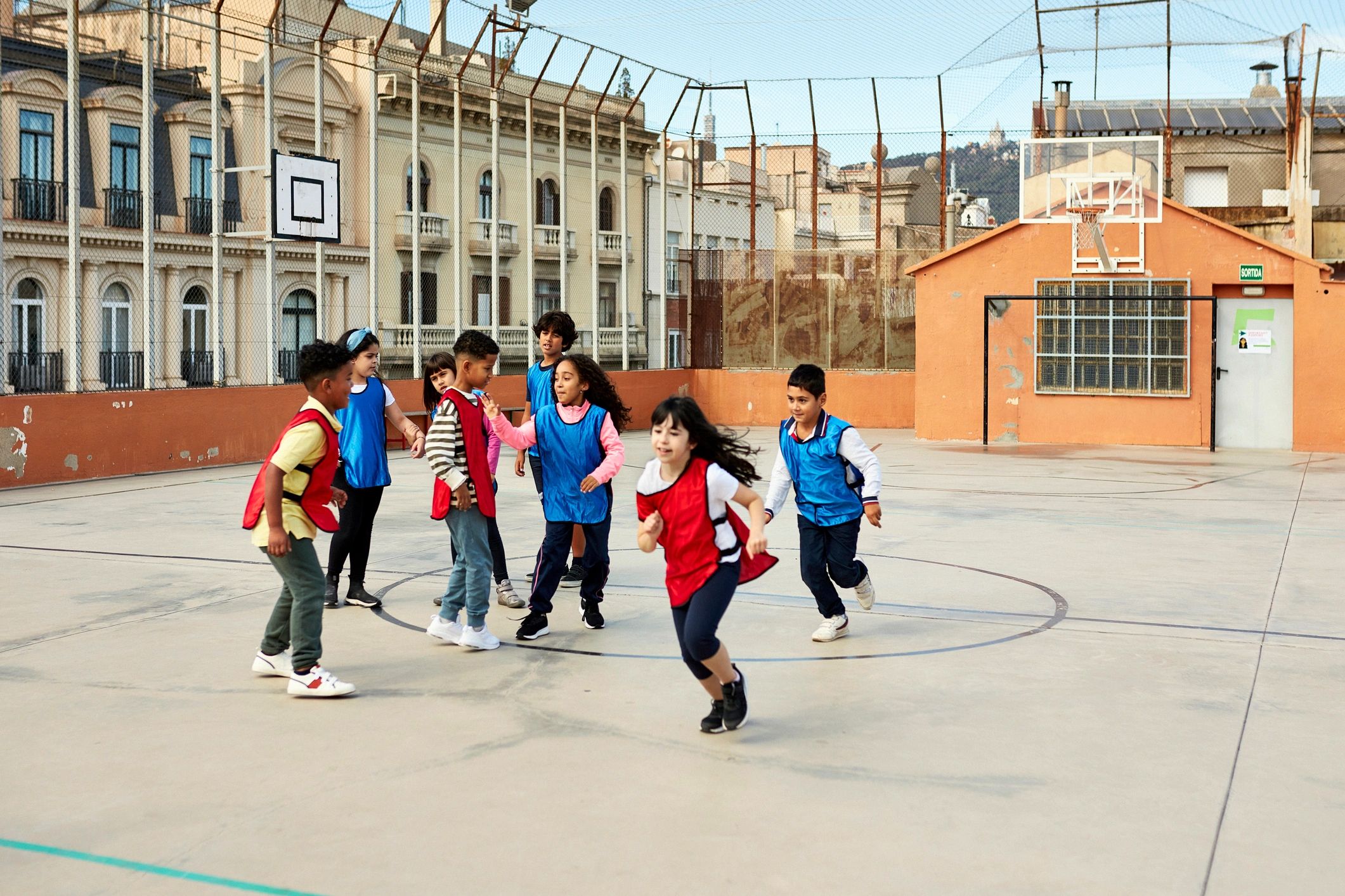 Multiracial group of children exercising together outdoors
