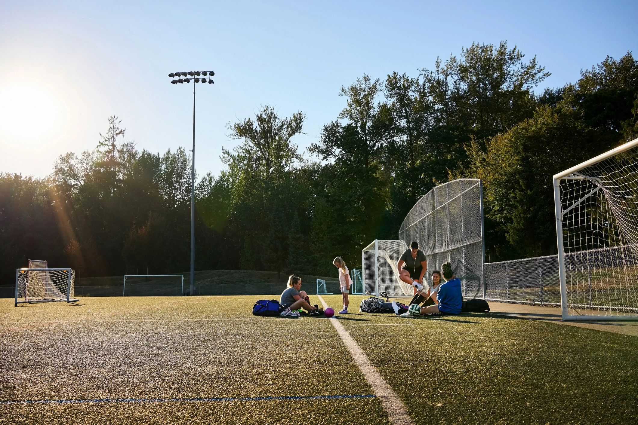 Young soccer players preparing together for team practice
