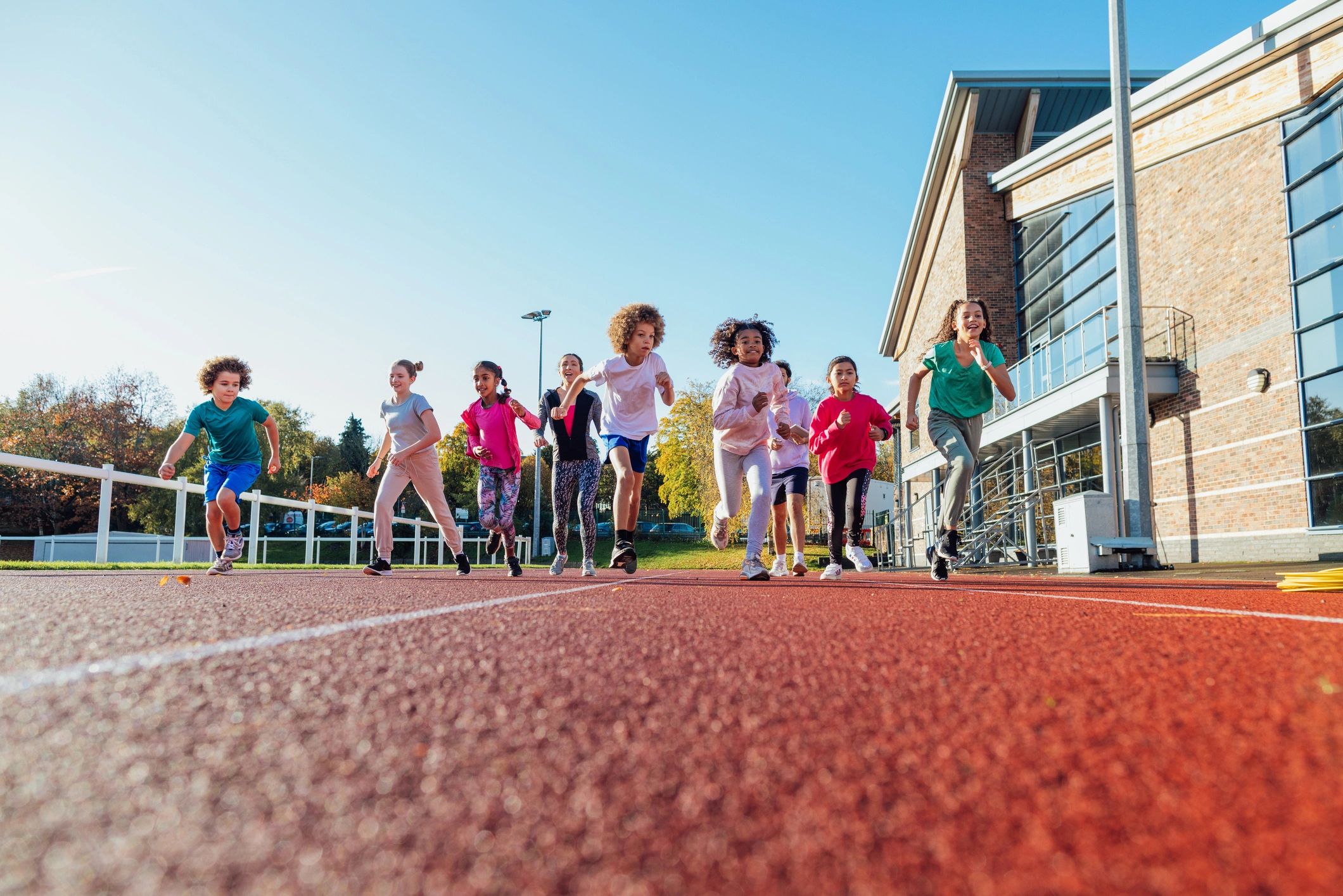 Young athletes running together during outdoor training